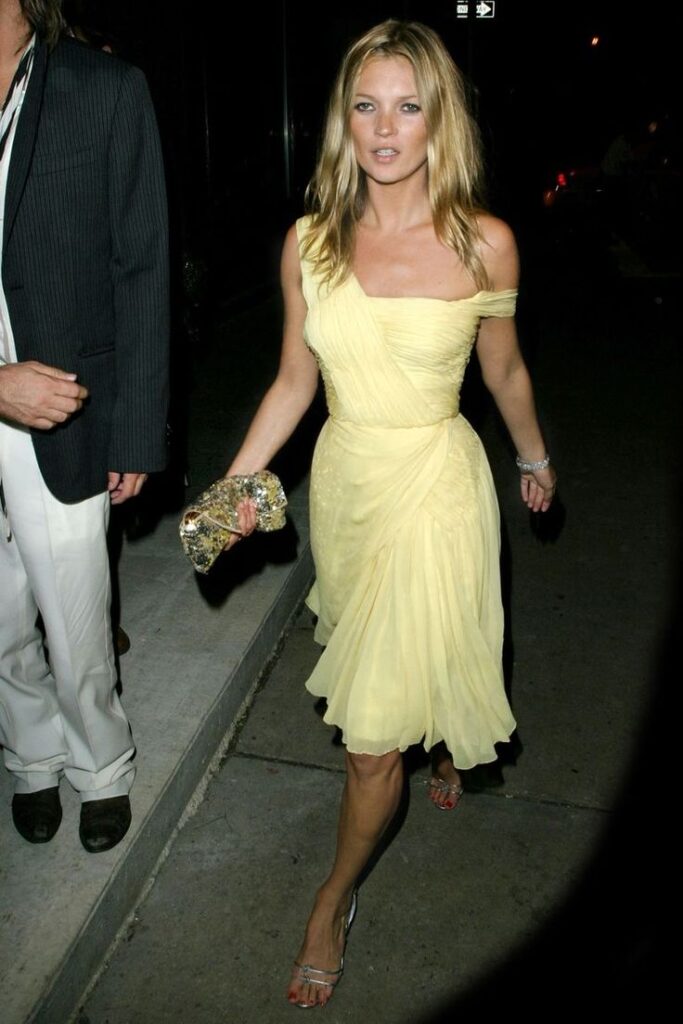 Kate Moss Wearing Her Iconic Off-The-Shoulder Yellow Dress